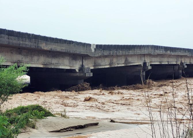 Overflowing Devika river under Jammu-Pathankot National Highway Overflowing Devika river under Jammu-Pathankot National Highway