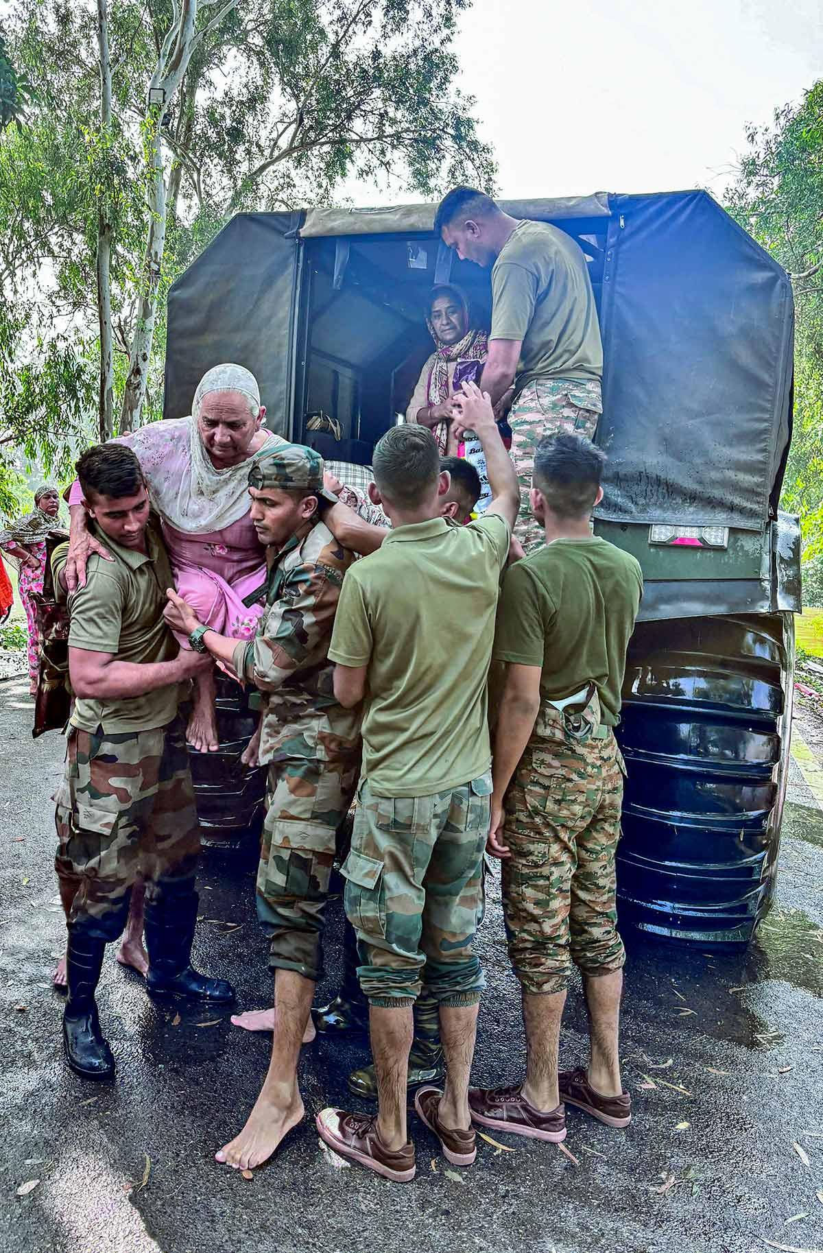 Indian Army officer carries elderly woman during Ramdas flood rescue Indian Army officer carries elderly woman during Ramdas flood rescue
