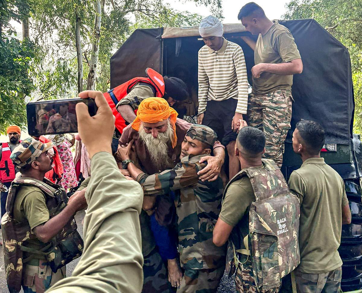 Indian Army rescues villagers affected by River Ravi overflow Indian Army rescues villagers affected by River Ravi overflow