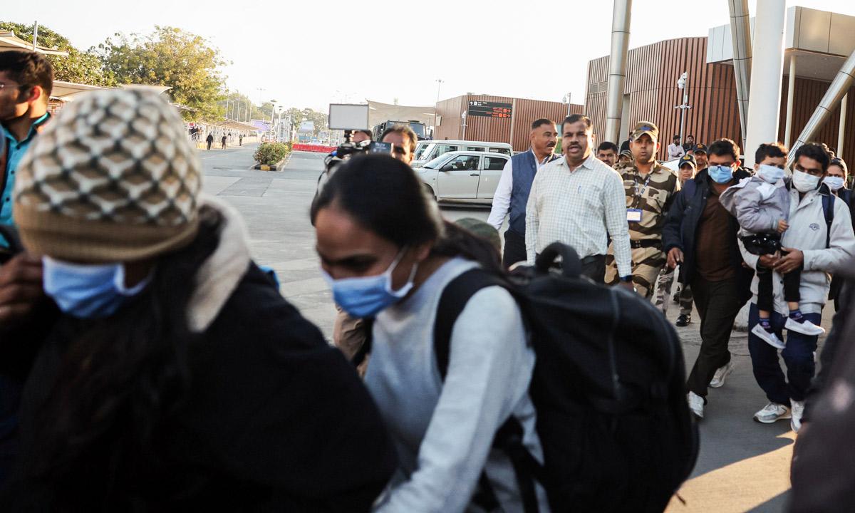 Indian immigrants who allegedly illegally migrated to the US arrive at Sardar Vallabhbhai Patel International Airport