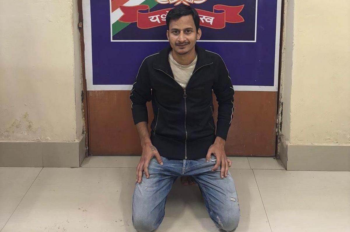 Akash Kannojia in custody of RPF at Durg Railway Station in Chhattisgarh/ANI on X