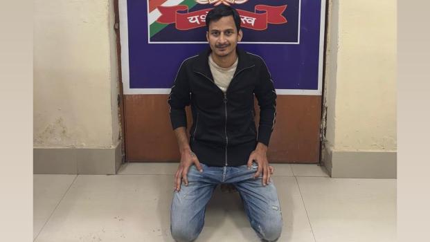 Akash Kannojia in custody of RPF at Durg Railway Station in Chhattisgarh/ANI on X