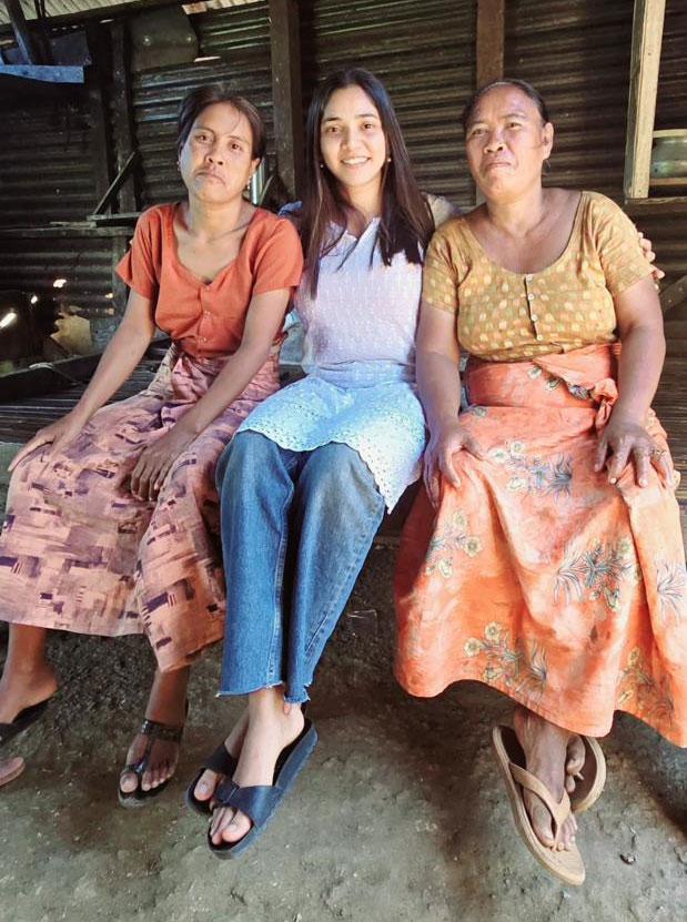 Meghana with Basil's family in their village.