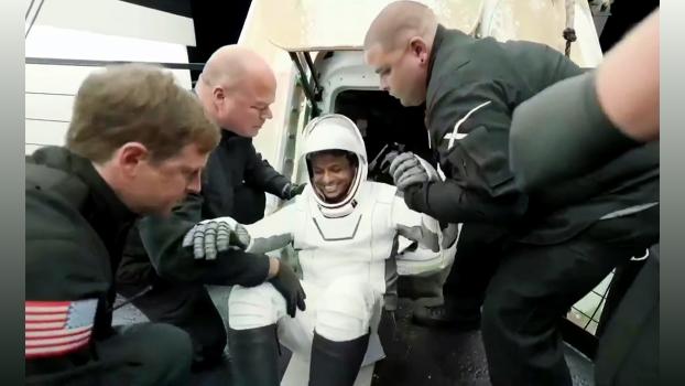 ISRO astronaut Group Captain Shubhanshu Shukla smiles and waves after exiting the Dragon spacecraft/Axiom Space/YouTube/ANI Photo