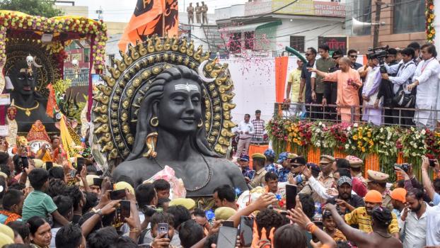 Uttar Pradesh CM Yogi Adityanath showers flower petals on Kanwar yatris in Meerut
