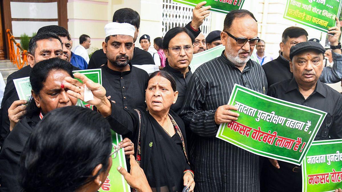 RJD leader Rabri Devi with party legislators holding placards protest against SIR (Special Intensive Revision) exercise in Bihar