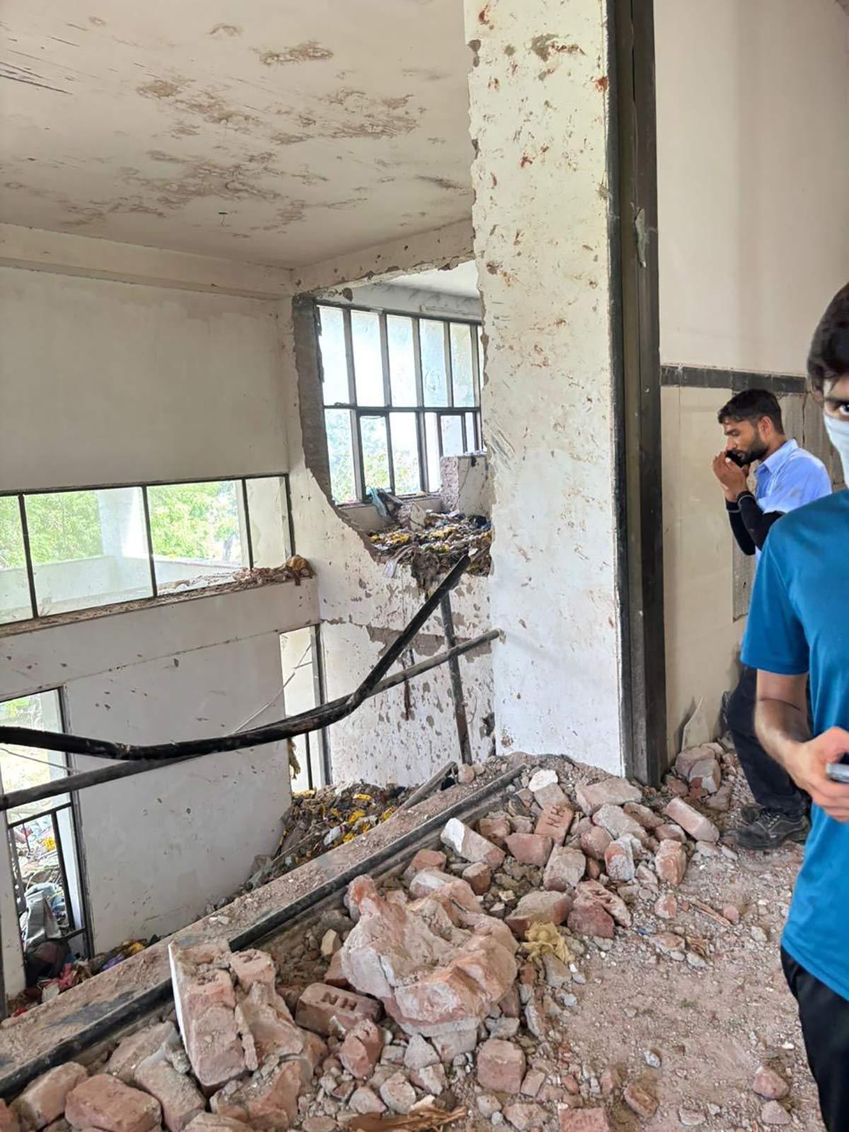 Damaged and broken walls of the BJ Medical College after the plane crashed into the building