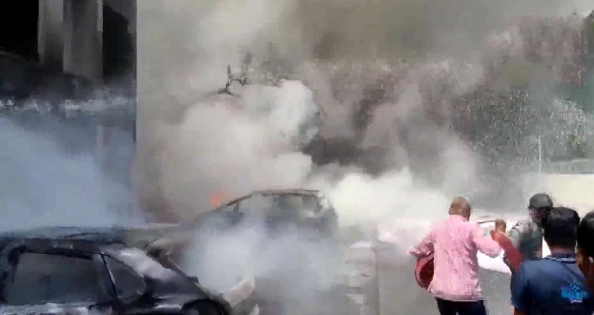 Smoke bellows from the crash site