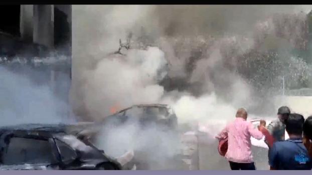 Smoke bellows from the crash site