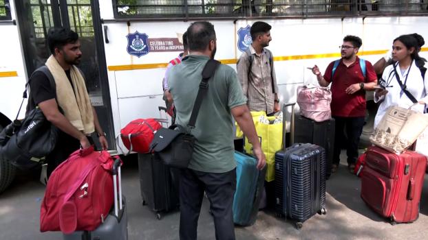 Students, professors, family members, and staff exit BJ Medical College's doctors' hostel/ANI Video Grab