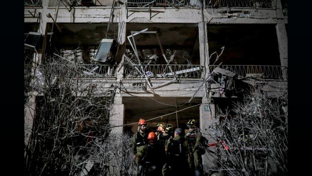 IMAGE: Rescue personnel work at an impact site following missile attack from Iran on Israel, in Ramat Gan. Photograph:  Itai Ron/Reuters