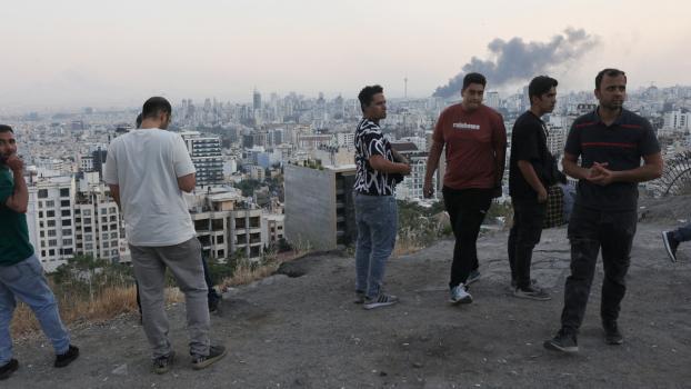 Smoke rises from a broadcasting station in Tehran