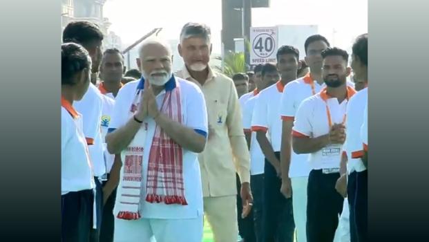 PM Narendra Modi interacts with participants at the Yoga session in Visakhapatnam/ANI on X