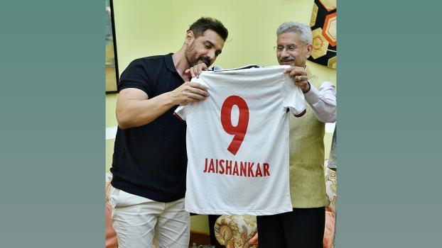 EAM S Jaishankar being presented a jersey by actor John Abraham, in New Delhi/ANI Photo