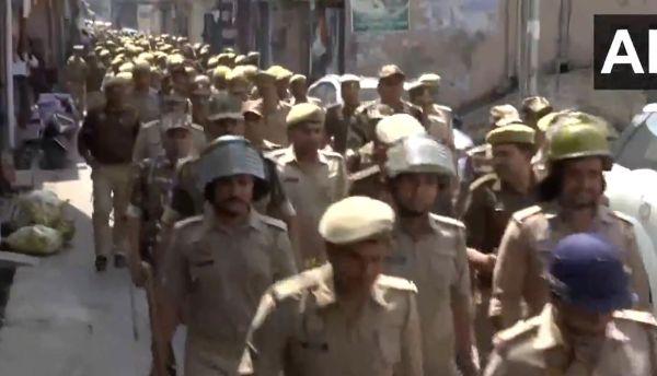 Police conduct a flag march in Sambhal