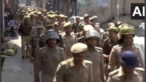 Police conduct a flag march in Sambhal