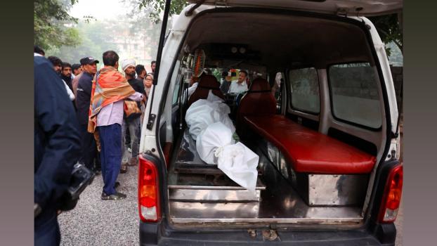 A blast victim being taken to the mortuary