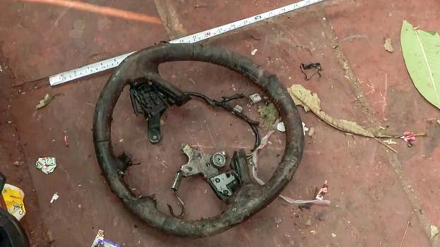 Car parts strewn around after the blast