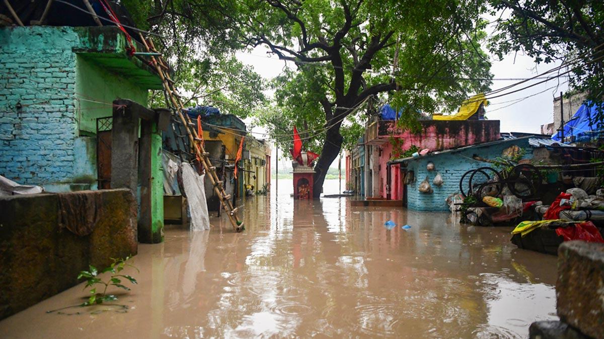 Houses submerge in water as the river Yamuna crosses the danger mark following incessant rainfall, at Yamuna Bazar in New Delhi