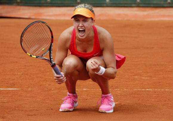 Eugenie Bouchard of Canada reacts after winning her women's quarter-final match against Carla Suarez Navarro of Spain 