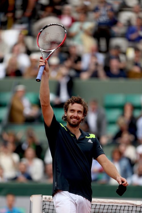 Ernests Gulbis of Latvia celebrates victory in his men's singles quarter-final match against Tomas Berdych 
