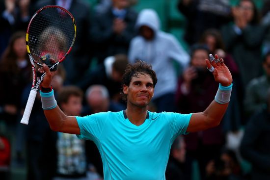 Rafael Nadal of Spain celebrates victory in his men's singles quarter-final match against David Ferrer of Spain 