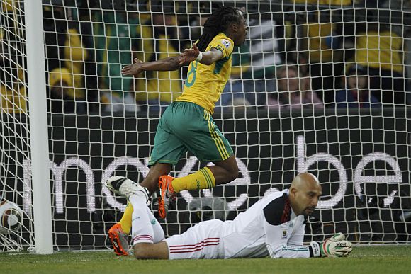 South Africa's Siphiwe Tshabalala celebrates after scoring the first goal past Mexico's goalkeeper Oscar Perez