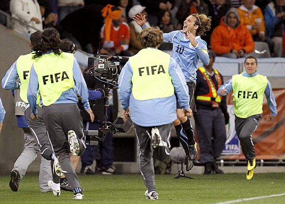 Uruguay's Diego Forlan celebrates after scoring.