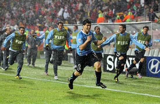 Luis Suarez celebrates after scoring
