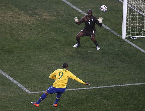 Brazil's Luis Fabiano (9) scores as Ivory Coast's goalkeeper Boubacar Barry