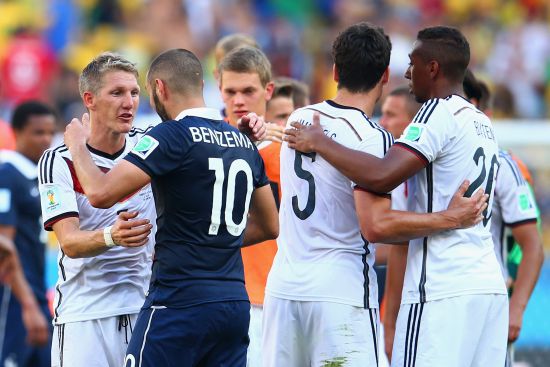 Bastian Schweinsteiger of Germany and Karim Benzema of France greet 