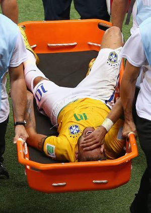 Neymar is carried off in the closing stages of the quarter-final match against Colombia