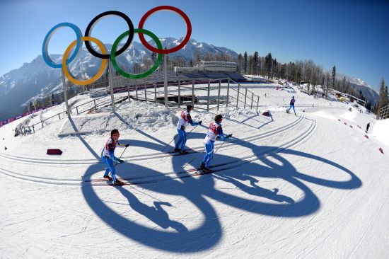 Officials pass the Olympic rings during training ahead of the Sochi 2014 Winter Olympics