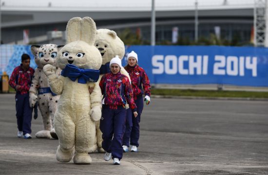 Staff members accompany Olympic mascots in the Athletes Village at the Olympic Park 
