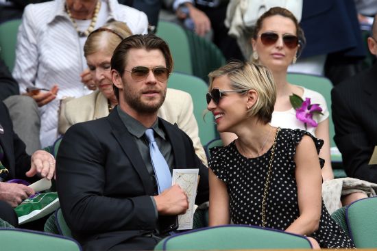 Australian actor Chris Hemsworth, star of last year's runaway hit Rush, with Elsa Pataky in the Royal Box on Centre Court before the Gentlemen's Singles Final match between Roger Federer of Switzerland and Novak Djokovic of Serbia