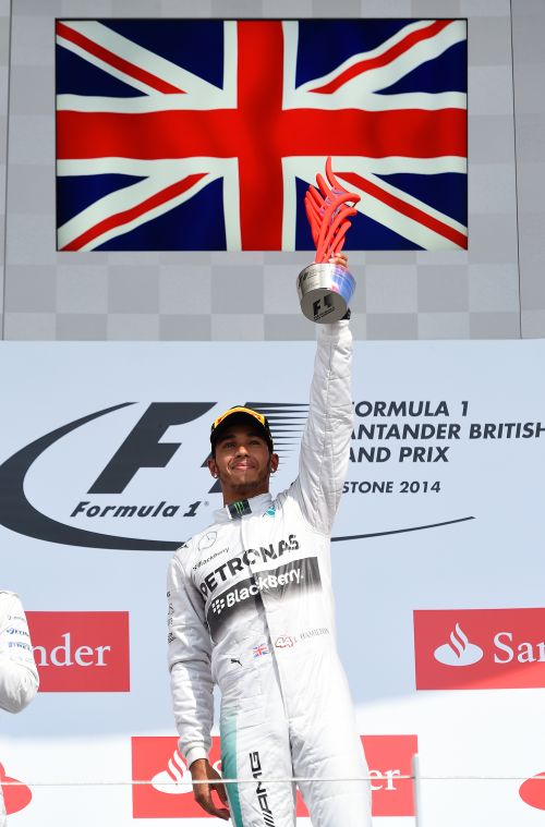  Lewis Hamilton of Great Britain and Mercedes GP celebrates on the podium after winning the British Formula One Grand Prix 