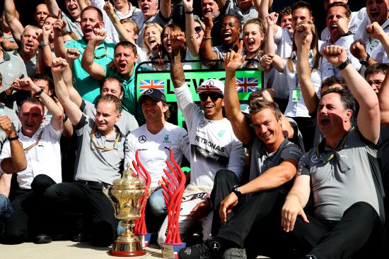 Lewis Hamilton of Great Britain and Mercedes GP celebrates with his team 