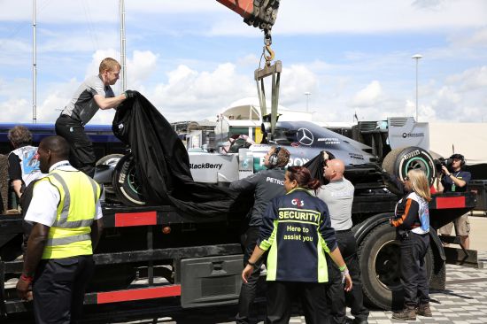 The car of Mercedes Formula One driver Nico Rosberg of Germany is covered after retiring due to gearbox problems 
