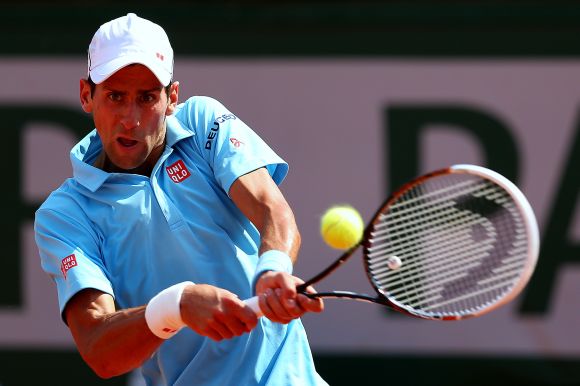 Novak Djokovic of Serbia returns a shot during his men's singles final match against Rafael Nadal of Spain 