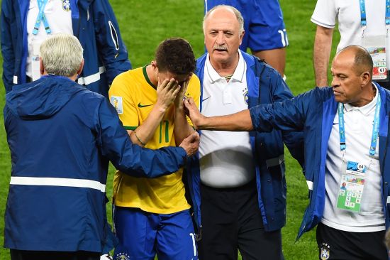 Head coach Luiz Felipe Scolari of Brazil and staff console Oscar 