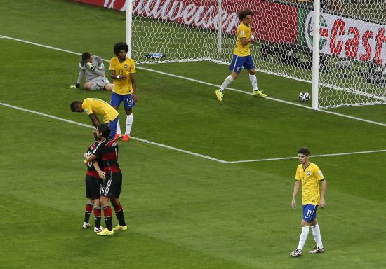 Brazilian players react after conceding a goal