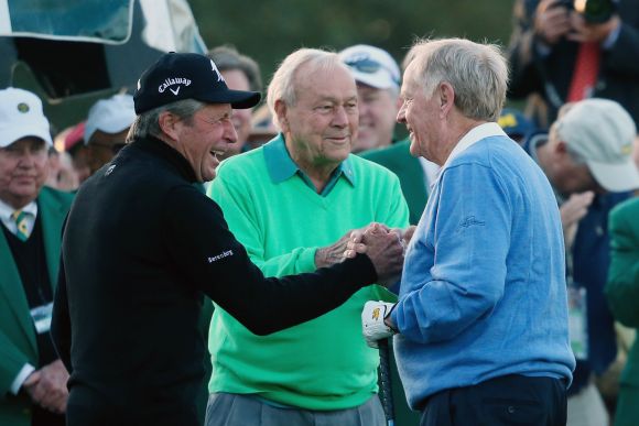 Honorary starters Gary Player, Arnold Palmer and Jack Nicklaus greet each other on the first tee at the start of the first round of the 2014 Masters Tournament at Augusta National Golf Club
