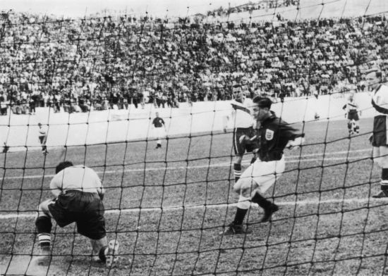 American goalkeeper Frank Borghi saves in front of Tom Finney during the England-USA match 