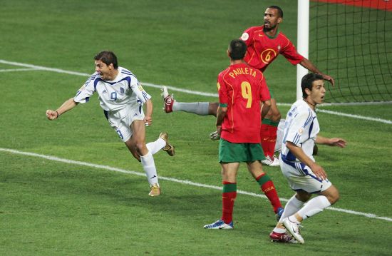 Angelos Charisteas of Greece celebrates scoring their first goal 