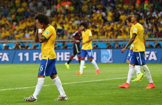 A dejected Marcelo of Brazil reacts after Germany's seventh goal