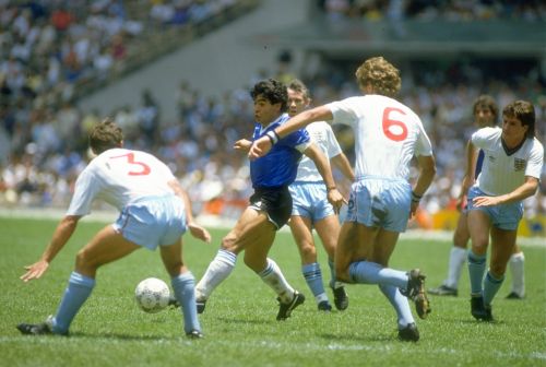 Diego Maradona dribbles on way to his second goal during the 1986 World Cup match against England