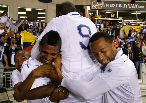 Carlo Costly #13 of Honduras reacts after scoring his second goal against Ecuador with Wilson Palacios #8, Maynor Figueroa #3, Jerry Palacios #9 