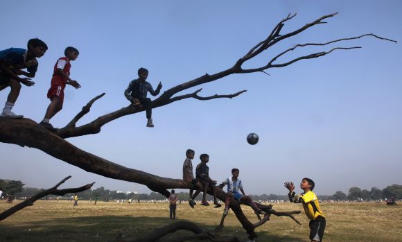 Kids play football in Kolkata