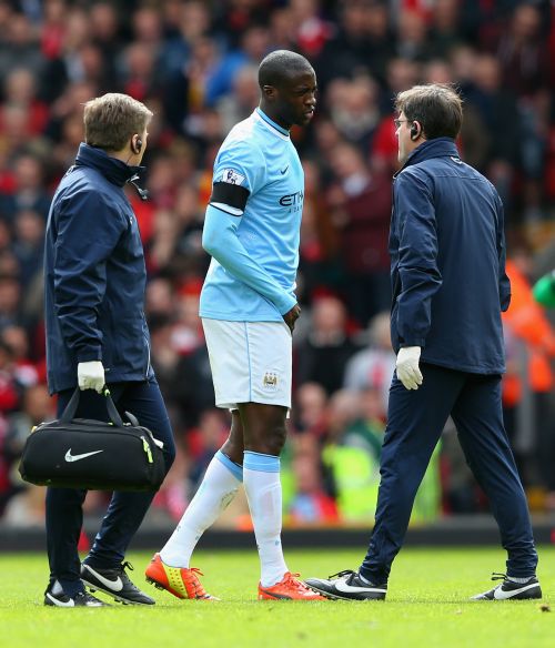 Yaya Toure of Manchester City goes off injured during the Barclays Premier League match between Liverpool and Manchester City 