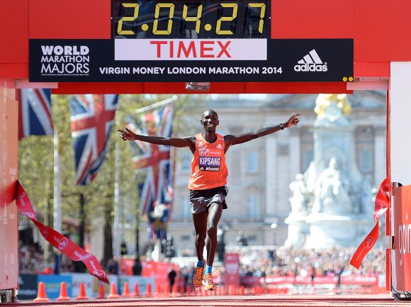 Wilson Kipsang of Kenya crosses the finish line to win the men's elite race at the Virgin London Marathon 